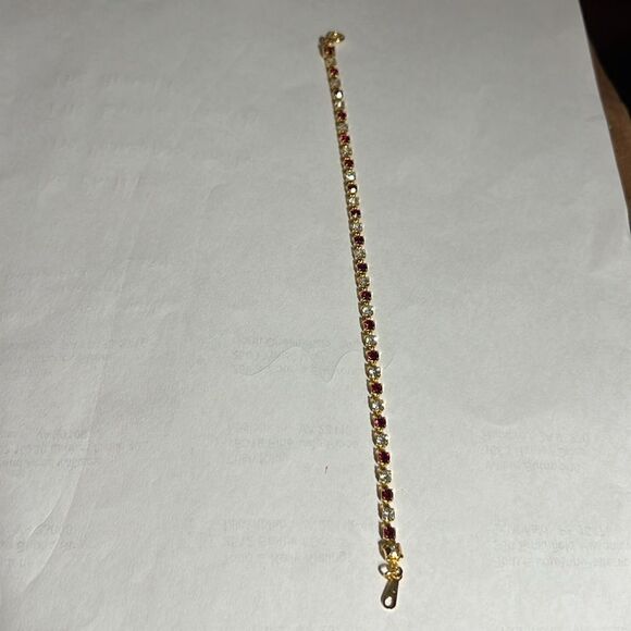 Ladies 8” faux Ruby/Diamond tennis bracelet. - Picture 4 of 5